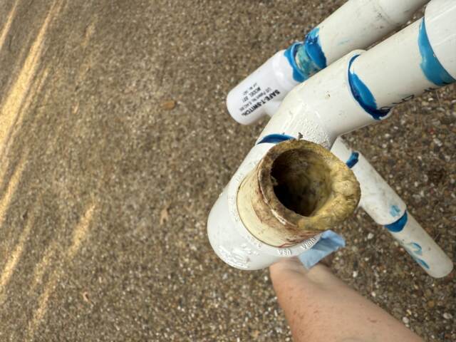 Drain line before cleaning, it's totally clogged inside