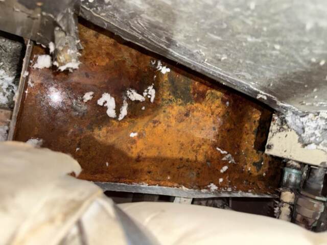 Inside attic water sitting in pan after the ice had thawed out