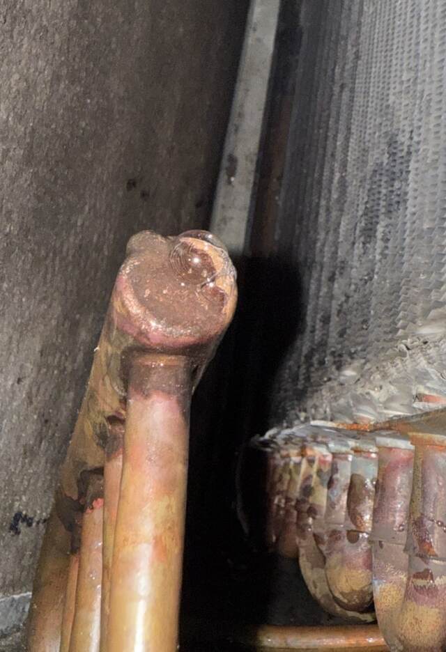 Closer look at the coil showing a buble from the refrigerant leak
