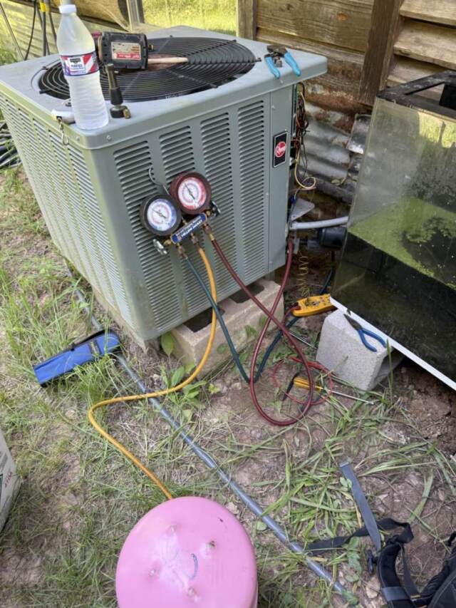 Guages connected showing refrigerant being added