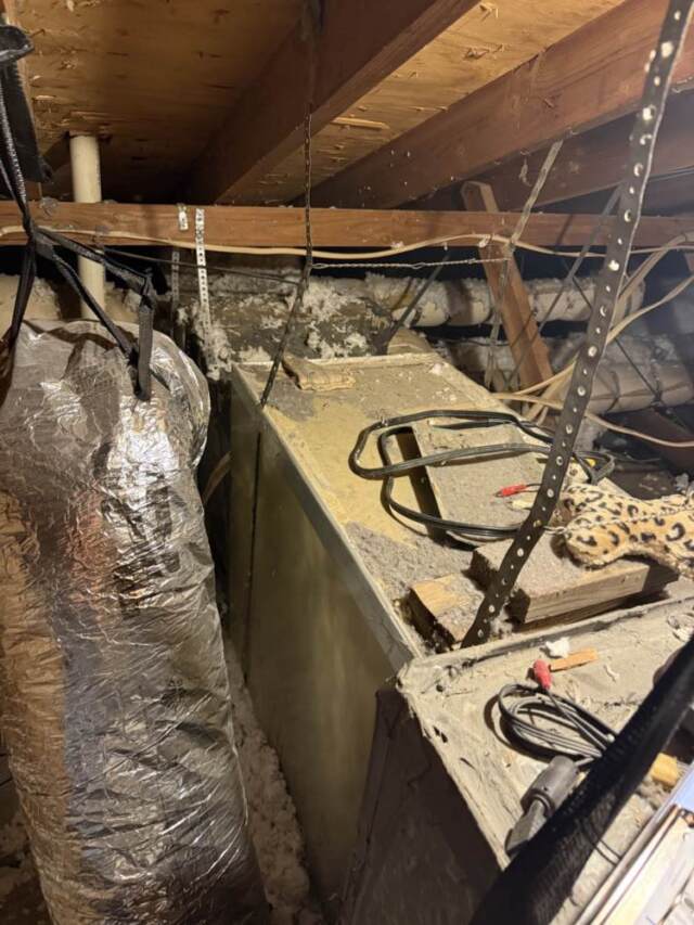 Old airhandler and ductwork in attic