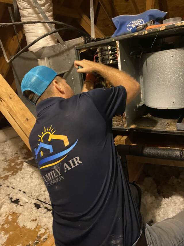 Technician is wiring the new system