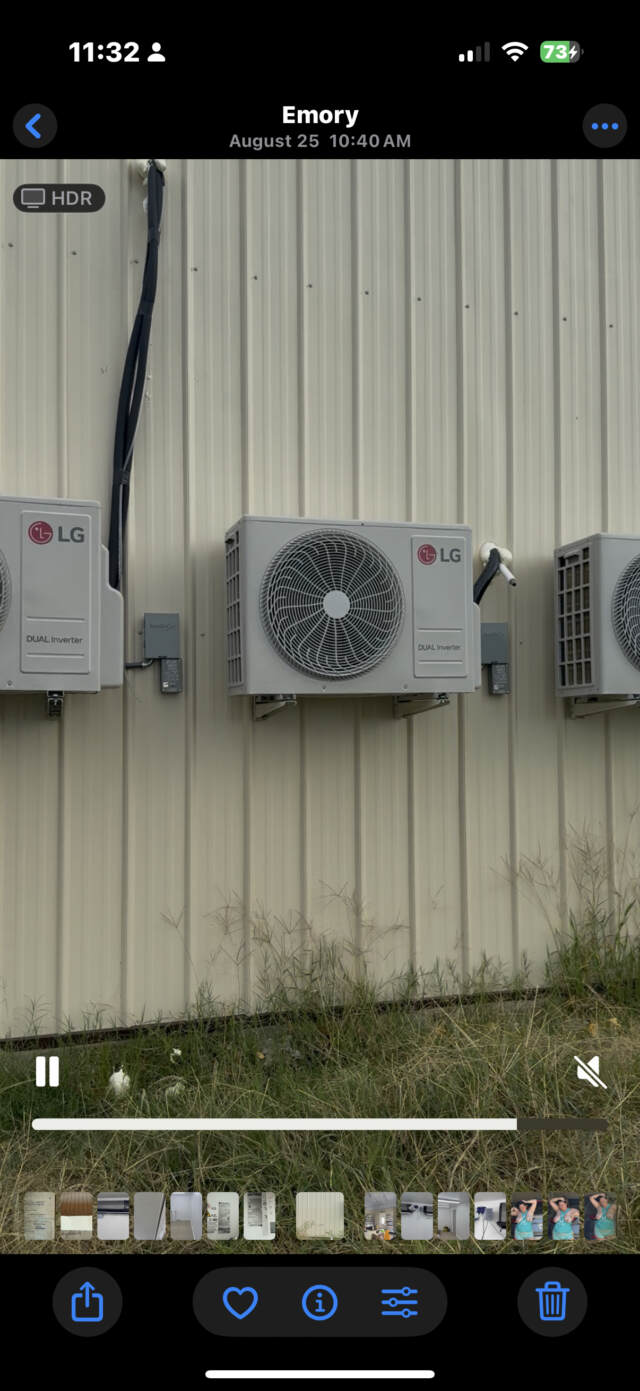 Three LG ductless mini splits hanging on the wall