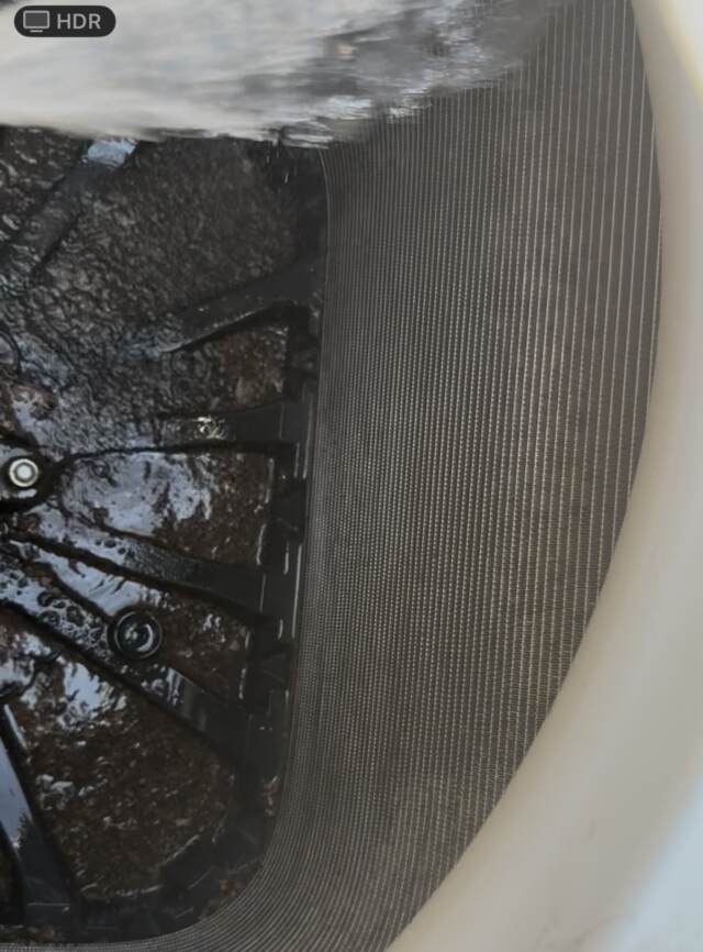 Spraying the inside of the condenser coil with water