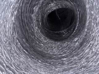 Looking inside the main duct line you can see here the layer of white dust has been removed.