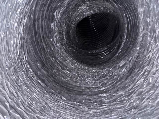 Looking inside the main duct line you can see here the layer of white dust has been removed.