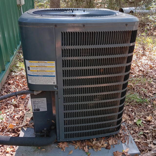 Goodman heat pump located outside the house