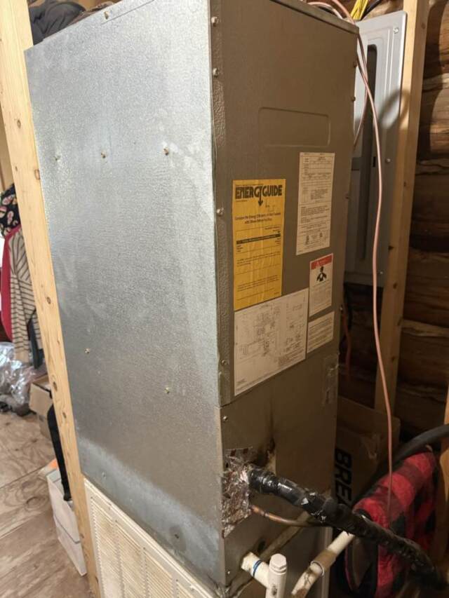 Electric airhandler standing vertically inside the house.
