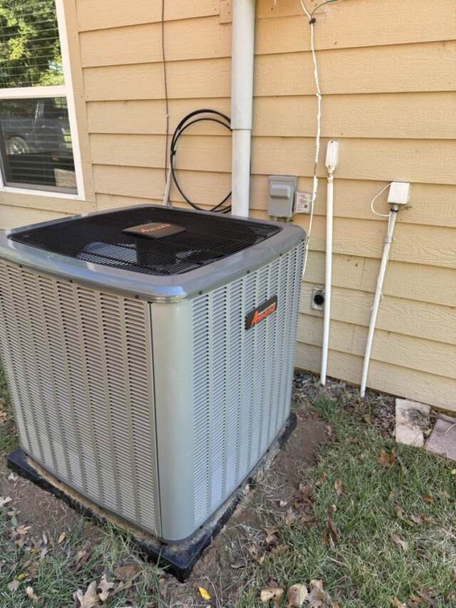 Looking at the outdoor heat pump.