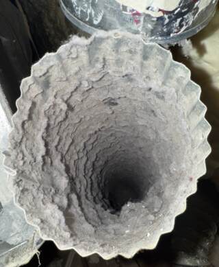 Dryer vent pipe before cleaning