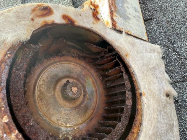 This is the rusted and broken inducer motor assembly