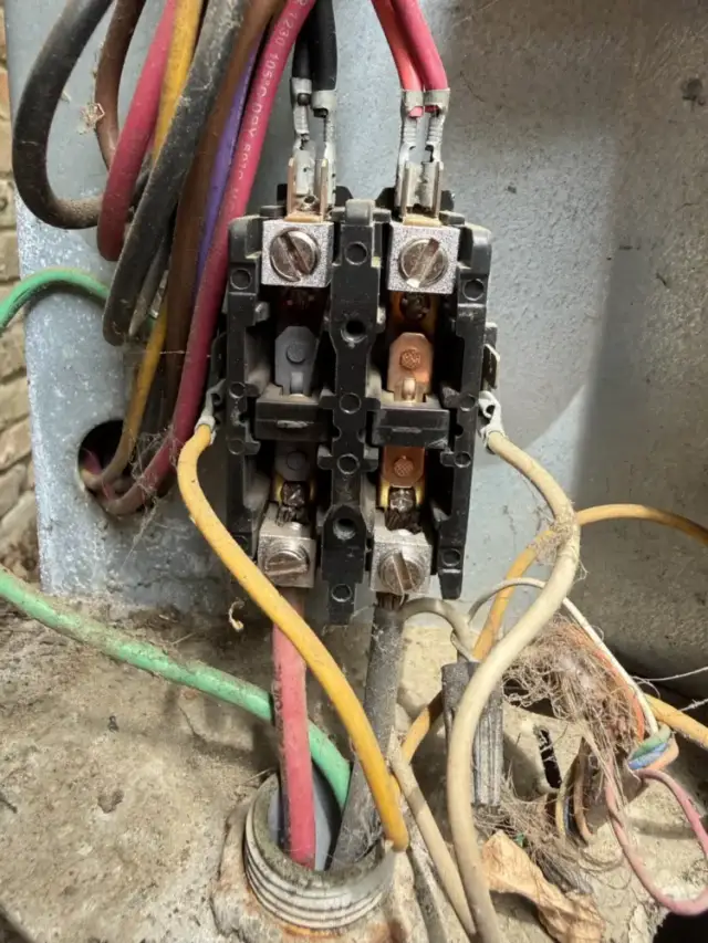 left side of relay is black and burned compared to the right side which is a shiny copper color