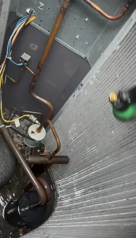 picture shows water nozzle cleaning inside of the heat pump coil