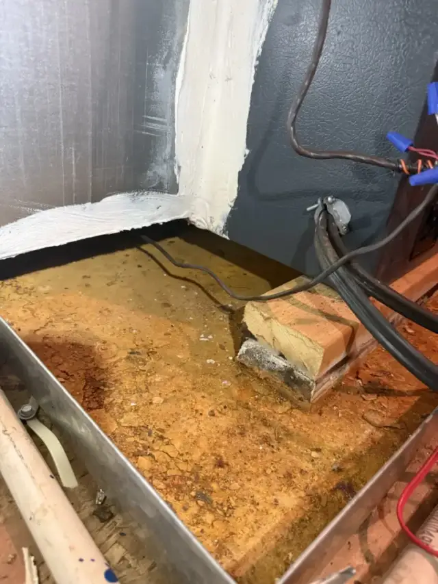 This is the emergency drain pan that sits underneath the system. It has held water in the past which has caused it to rust and now needs replaced.