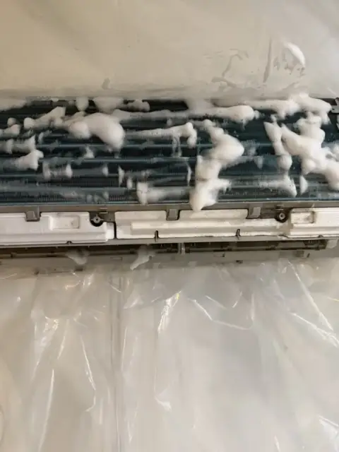 Foaming cleaner sprayed on coil and blower wheel to loosen and push dirt and grime out