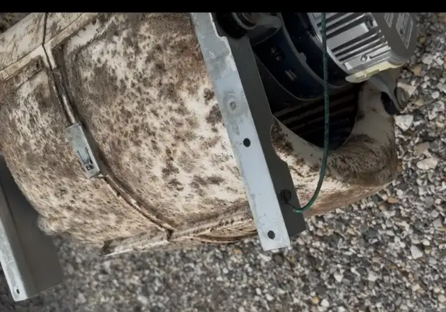 Picture of the blower housing before cleaning with biological growth