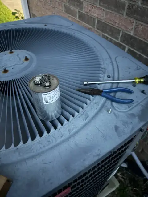 new replacement capacitor about to go in.