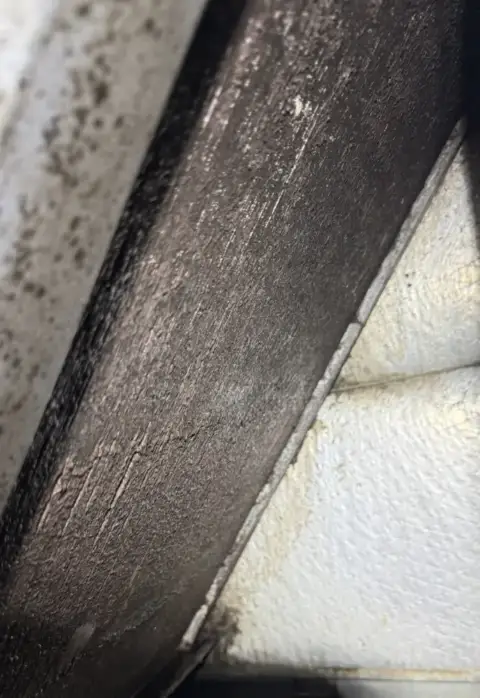 Evaporator coil before cleaning, you can see the black grime on the coil