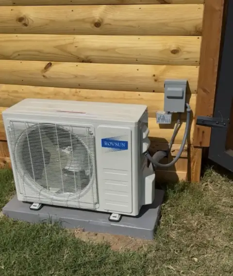 This is the outdoor heat pump with a surge protector on the disconnect
