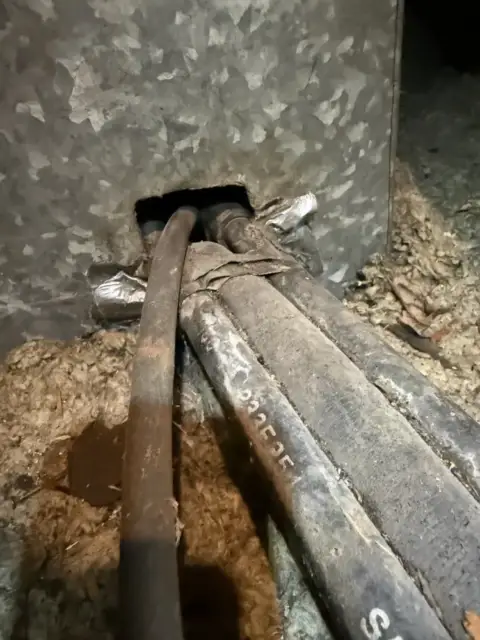 hole in metal plenum sucking in hot attic air
